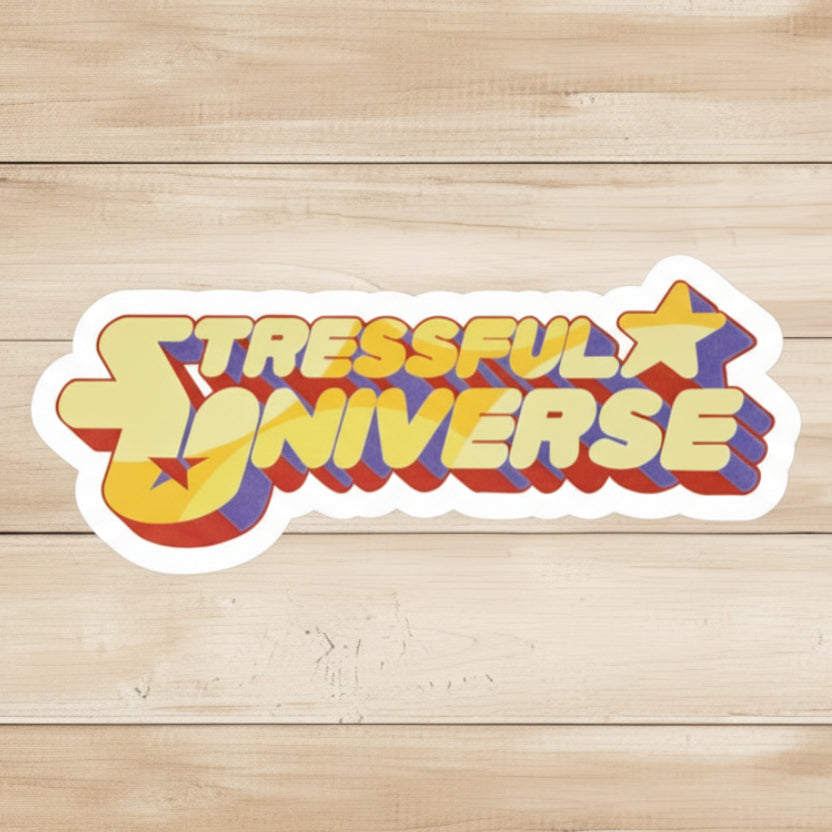 die-cut classic glossy vinyl sticker of text Stressful Universe with a star