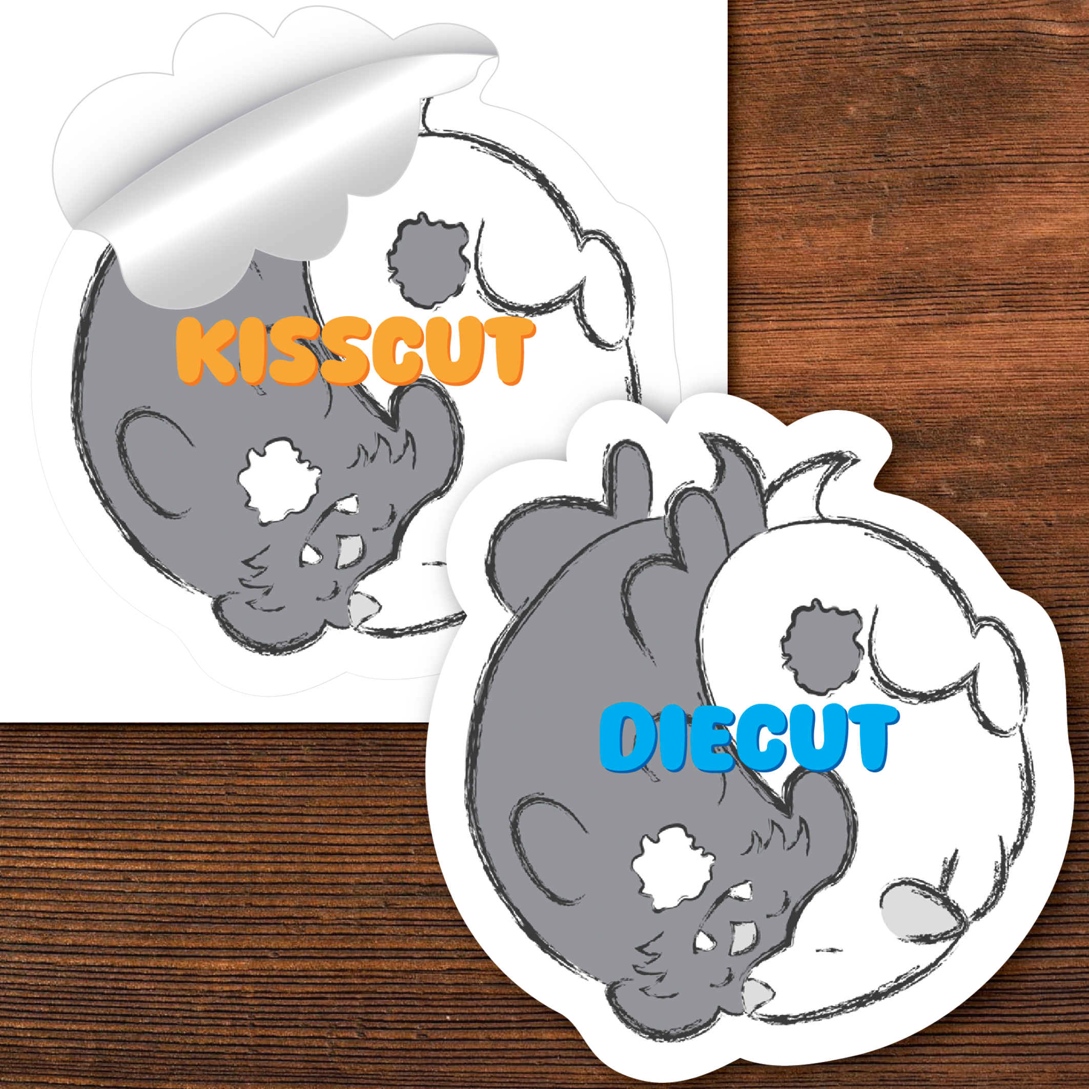 Two die-cut mouse shapes with 'Kisscut' and 'Diecut' text on a wooden surface.