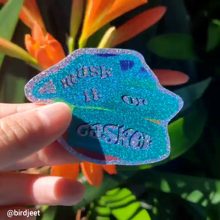 gif of a glitter effect sticker shining in the sunlight