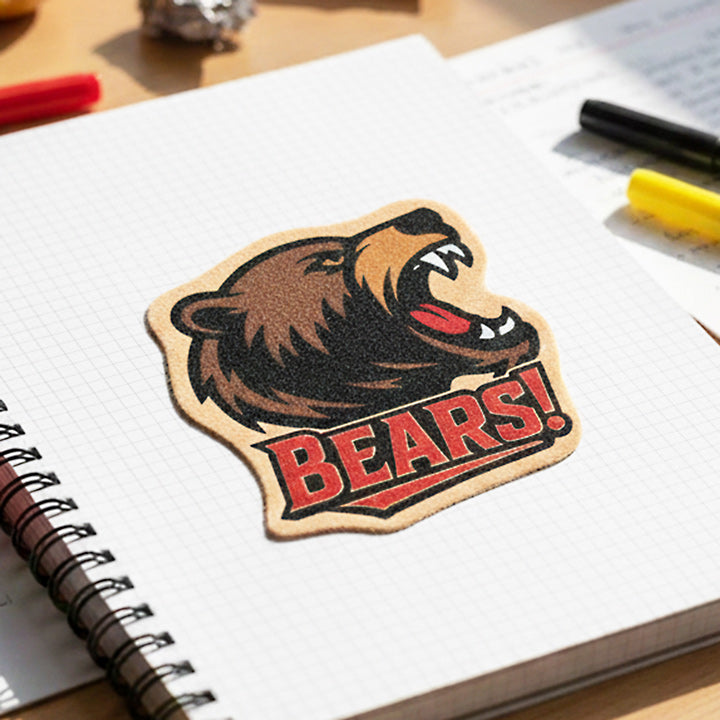 Bear-themed sticker with 'BEARS!' text with a fuzzy texture on a notebook